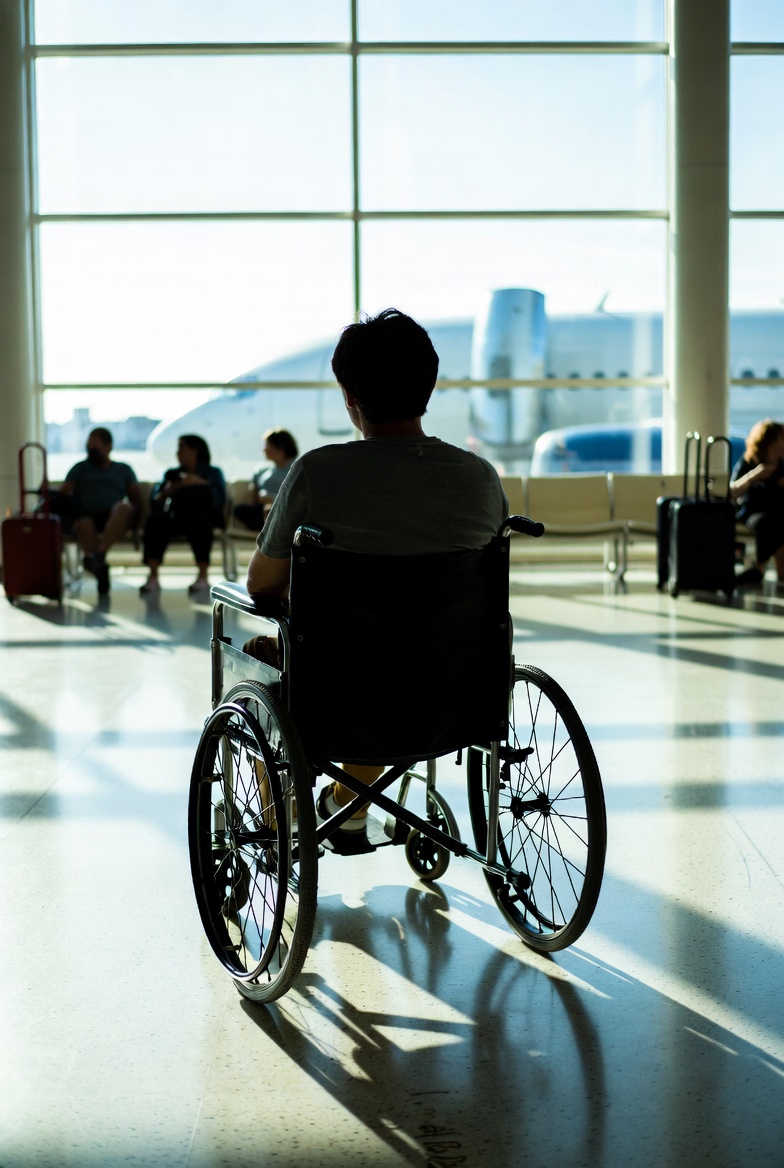 WheelChairAirport Image of someone in a wheelchair at an airport